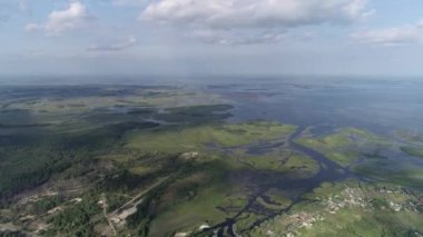The village of Strakholissya. The general plan of the village near the Chernobyl exclusion zone. Dnepr River. Summer. Aerial. Kyiv Oblast, Ukraine.