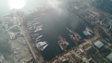 The ships are moored in the dock. Dry dock. Aerial. Kyiv. Ukraine. Autumn. Fog. 