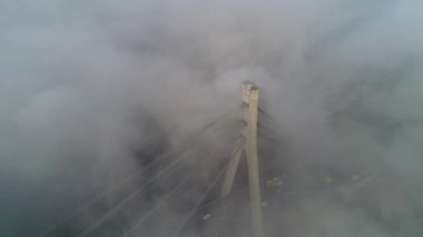 Aerial drone view View Of North or Moscow Bridge Kiev. Ukraine over Dnieper. City view. Traffic on the bridge. Fog.