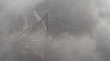 Aerial drone view View Of North or Moscow Bridge Kiev. Ukraine over Dnieper. City view. Traffic on the bridge. Fog.