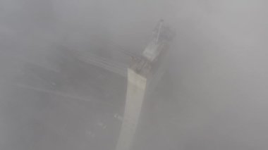 Aerial drone view View Of North or Moscow Bridge Kiev. Ukraine over Dnieper. City view. Traffic on the bridge. Fog.