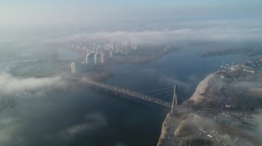 Aerial drone view View Of North or Moscow Bridge Kiev. Ukraine over Dnieper. City view. Traffic on the bridge. Fog.