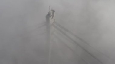 Aerial drone view View Of North or Moscow Bridge Kiev. Ukraine over Dnieper. City view. Traffic on the bridge. Fog.