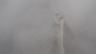 Aerial drone view View Of North or Moscow Bridge Kiev. Ukraine over Dnieper. City view. Traffic on the bridge. Fog.