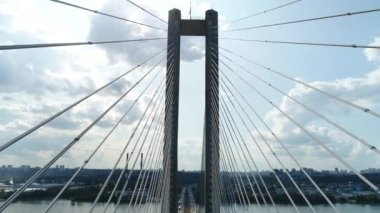 Aerial survey of the south bridge in Kyiv through the Dnieper. Ukraine. Summer. Warm morning.