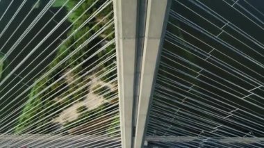 Aerial survey of the south bridge in Kyiv through the Dnieper. Ukraine. Summer. Warm morning.