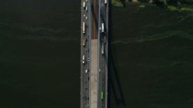 Aerial survey of the south bridge in Kyiv through the Dnieper. Ukraine. Summer. Warm morning.