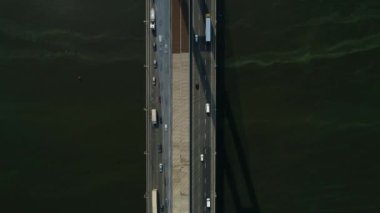 Aerial survey of the south bridge in Kyiv through the Dnieper. Ukraine. Summer. Warm morning.