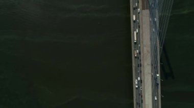Aerial survey of the south bridge in Kyiv through the Dnieper. Ukraine. Summer. Warm morning.