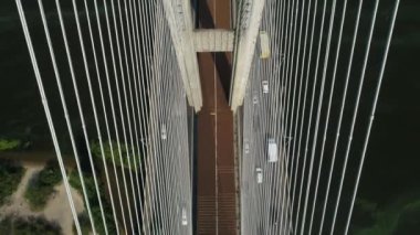 Aerial survey of the south bridge in Kyiv through the Dnieper. Ukraine. Summer. Warm morning.