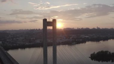 Sunset over the Dnieper river. South bridge. Peak hour. Aerial. Kyiv. Ukraine. Summer. 