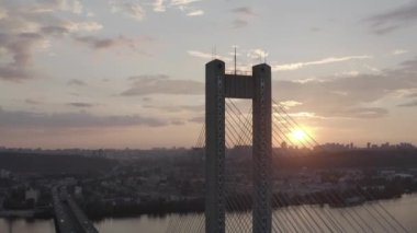 Sunset over the Dnieper river. South bridge. Peak hour. Aerial. Kyiv. Ukraine. Summer. 