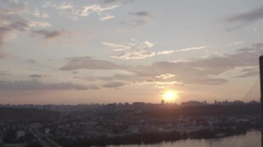 Sunset over the Dnieper river. South bridge. Peak hour. Aerial. Kyiv. Ukraine. Summer. 
