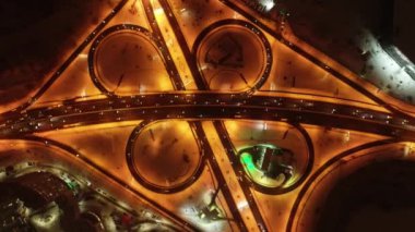 Ring road in winter. Traffic movements during rush hour. Kyiv. Ukraine. Obolonsky district. Drone video. Night. 