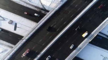 Ring road in winter. Traffic movements during rush hour. Kyiv. Ukraine. Obolonsky district. Drone video. 