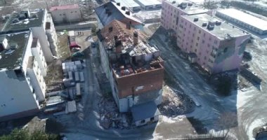Ruins of house, damaged by shelling, Russian attack. Destruction caused by war in Ukraine, collapsed building.  Buzova. Aerial.