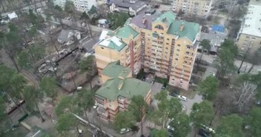 Destruction after an air strike on residential buildings of civilians. War in Ukraine. Destroyed houses. Aerial. Irpin City.