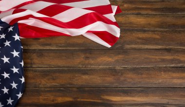 Wooden background with an american flag