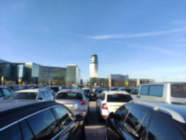 Blurred vienna airport parking lot with a tower at the back