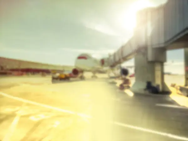 stock image Blur Plane on an airport connected to the gate sleeve