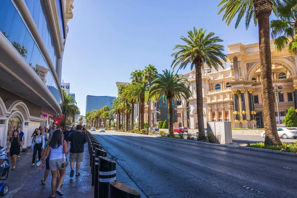 stock image View of people walking in shadow of hotel buildings on sunny summer day. Strip, Las Vegas,  Nevada, USA. 09.18.2022.