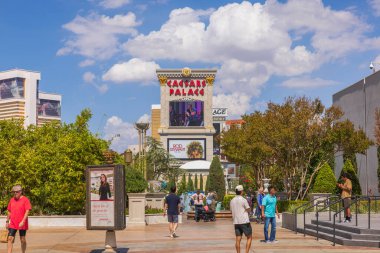 View of tourists near Caesars Palace hotel on sunny summer day. Las Vegas, Nevada, USA. 09.15.2022.
