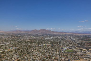 Beautiful aerial panoramic view of Las Vegas with mountain landscape in background. USA.