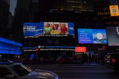 Beautiful view of night Broadway with advertising television screens on walls of skyscrapers. New York. USA. 09.21.2022