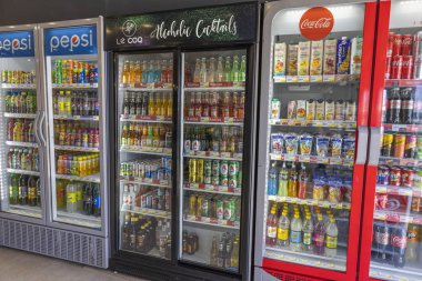 Close-up view of soft drinks and beer in cold stores of store in Greece. Rhodes. Greece. 09.25.2022.