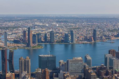 Beautiful aerial view of Manhattan skyscrapers against backdrop of landscape of Hudson River. New York, USA.