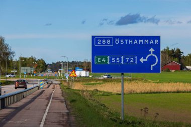 Close up view of motorway with road billboard with  screen. Sweden. Uppsala. 08.25.2022.
