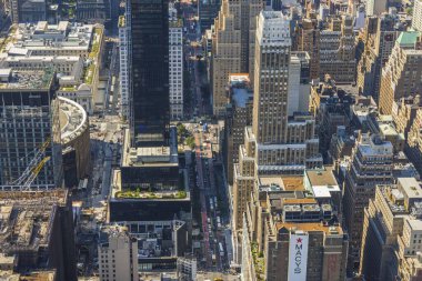 Beautiful top view from 86th floor of Empire State Building on streets of Manhattan in New York with Macy's department store. New York. USA. 09.21.2022