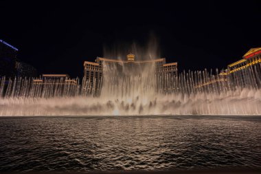 Beautiful view of sights of Las Vegas at night on Strip overlooking fountains of Bellagio hotel. Las Vegas. USA. 09.16.2022.