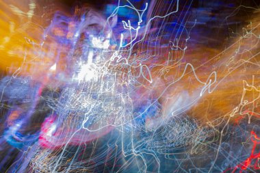 Beautiful out of focus view of abstract cityscape with the lights of passing cars. NY. USA