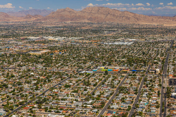 Gorgeous aerial view of Las Vegas with mountain landscape in background. USA.