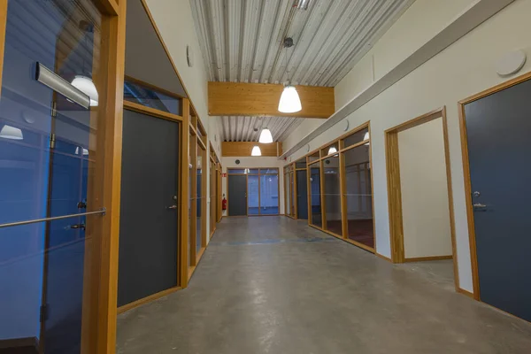 Beautiful hall in modern building with several isolated office rooms. Business concept. Sweden.