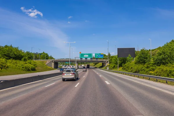 stock image Beautiful view of highway with cars  with green trees and blue sky. Sweden. Europe. 