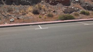 View of parking spaces for cars on highway in mountains. Gran Canaria. Spain.