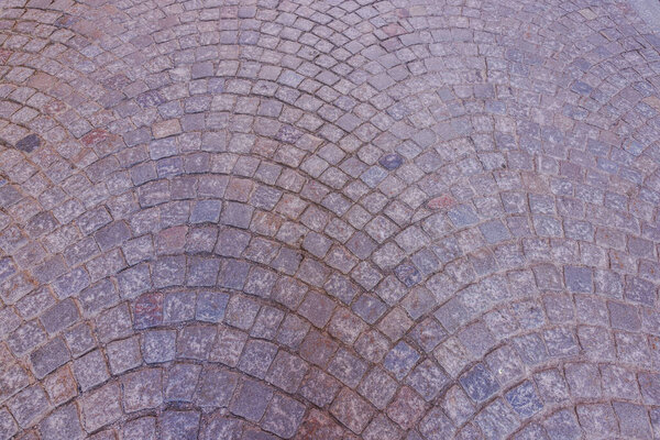 Close up view of cobblestone-paved square in Stockholm.