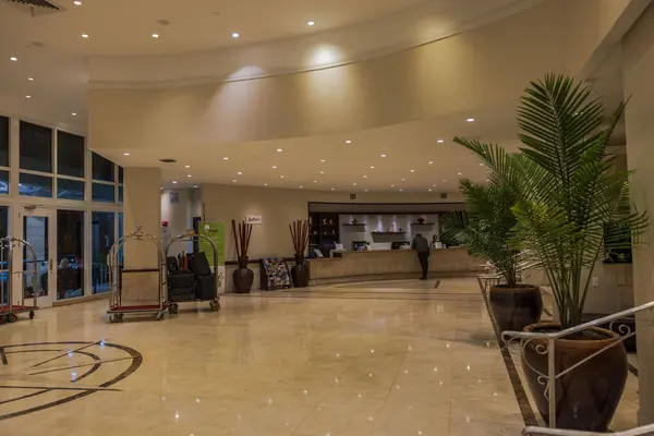 stock image Beautiful view of the lobby of the Radisson hotel and a visitor at the reception desk. Miam Beach. USA. 