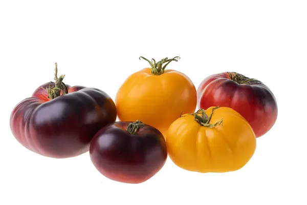 stock image Close up view of different varieties of tomatoes isolated on white background.