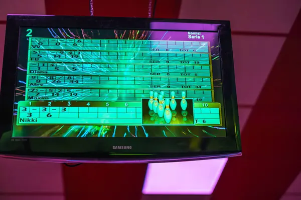 stock image Bowling score screen displaying player names and scores during an ongoing game. 