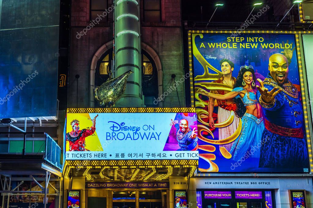 Night view of Aladdin Broadway show billboard and Disney on Broadway sign in New York City. USA.
