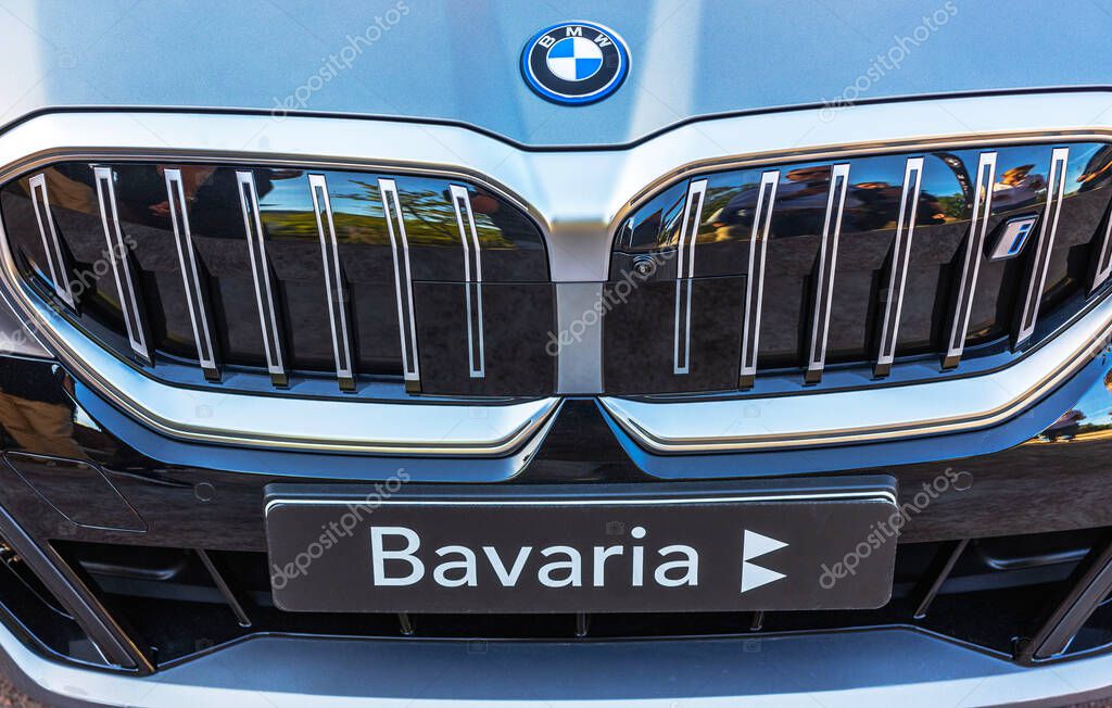 Front view of BMW i4 M electric car with iconic grille and Bavaria plate. Sweden.