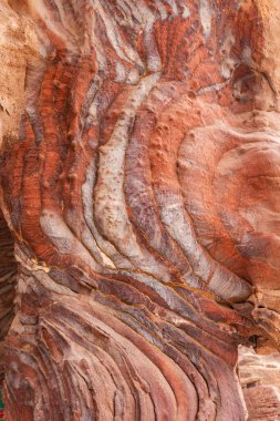 Kaleydoskopik dalga kumtaşı dokusu arka planı. Petra Arkeoloji Bölgesi. Ürdün.