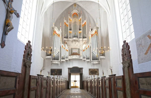 Large white church organ in an empty church, selective focus