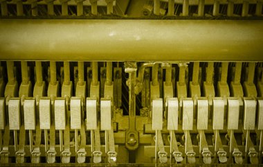 Details of piano mechanism gavel - string, pins and hammers, piano from 1973