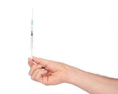 New syringe in adult hand on white background, medical and health care concept