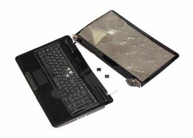 Old broken laptop isolated on white a background clipart