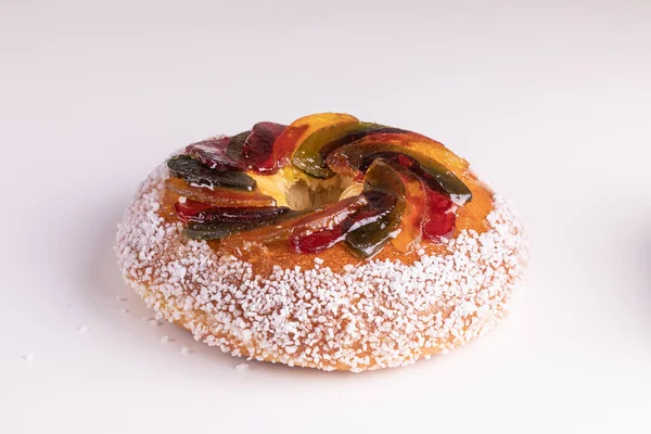 Rosca de reyes, king cake, glazed fruit, Provencal Galette des rois for the Epiphany on white background